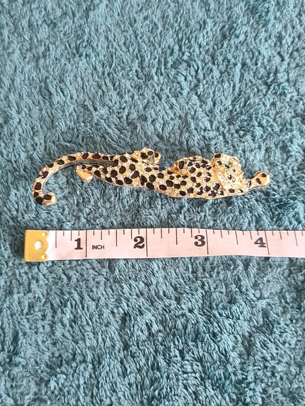 Vintage Gold-Tone Black and Clear Leopard Brooch with Green Eyes